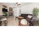 Cozy living room boasts a stone fireplace, comfortable seating, and stylish decor for relaxing evenings at 26826 N 66Th Ln, Phoenix, AZ 85083