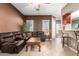 Inviting living room with a comfortable leather sofa and tiled floors at 26826 N 66Th Ln, Phoenix, AZ 85083