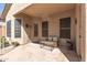 Inviting covered patio with wicker furniture and flagstone flooring at 26826 N 66Th Ln, Phoenix, AZ 85083