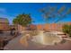 The backyard features an in-ground pool that is fenced-in with tiled coping and steps at 26826 N 66Th Ln, Phoenix, AZ 85083