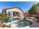 Inviting backyard pool and spa area perfect for relaxation and entertaining, surrounded by lush landscaping at 26826 N 66Th Ln, Phoenix, AZ 85083