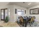 Bright dining area with banquette seating, a modern table, and view to the exterior at 28523 N 162Nd St, Scottsdale, AZ 85262