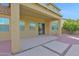 This back patio features sturdy support beams, a covered porch, and a sliding glass door at 3316 E Kingbird Pl, Chandler, AZ 85286