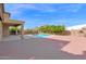 Home featuring a relaxing pool, extended patio, and mature trees at 3316 E Kingbird Pl, Chandler, AZ 85286