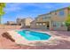 Home featuring a large pool with brick patio and steps that enter into the water at 3316 E Kingbird Pl, Chandler, AZ 85286