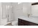 Bathroom with a glass enclosed shower, updated vanity, and modern fixtures at 3316 E Kingbird Pl, Chandler, AZ 85286