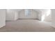 Spacious bonus room with neutral carpet, natural light, and vaulted ceiling at 3316 E Kingbird Pl, Chandler, AZ 85286