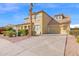 Charming two-story home with a tile roof, desert landscaping, and an attached two-car garage at 3316 E Kingbird Pl, Chandler, AZ 85286