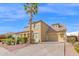 Charming two-story home with a tile roof, desert landscaping, and an attached two-car garage at 3316 E Kingbird Pl, Chandler, AZ 85286