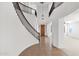 Elegant foyer featuring tile floors, staircase, chandelier, and wood door with glass panels, and plenty of space at 3316 E Kingbird Pl, Chandler, AZ 85286