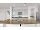 Bright kitchen with granite counters, gray cabinets, and stainless steel appliances at 3316 E Kingbird Pl, Chandler, AZ 85286