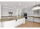 Bright kitchen featuring gray cabinets, stainless steel appliances, and a granite countertop island at 3316 E Kingbird Pl, Chandler, AZ 85286