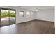 Living room with tile floors, ceiling fan, and sliding glass doors leading to a pool at 3316 E Kingbird Pl, Chandler, AZ 85286