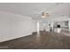 Open floor plan showcasing living area with tile floors leading to the kitchen at 3316 E Kingbird Pl, Chandler, AZ 85286