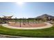 Community playground with shade and activity equipment at 34440 N Timberlake N Mnr, San Tan Valley, AZ 85144