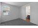 Bedroom featuring a large window and ensuite bathroom in a new home at 34464 N Timberlake N Mnr, San Tan Valley, AZ 85144