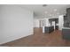 Spacious living area featuring tile floors and an open view towards the modern kitchen at 34464 N Timberlake N Mnr, San Tan Valley, AZ 85144