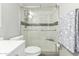 Updated bathroom featuring a glass shower enclosure, and sleek fixtures at 355 E Thomas Rd # B110, Phoenix, AZ 85012
