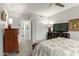 Bedroom featuring a comfortable bed, a television, and an ensuite bathroom at 355 E Thomas Rd # B110, Phoenix, AZ 85012