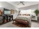 Well-lit bedroom with a patterned comforter, mirrored nightstands, and a television at 355 E Thomas Rd # B110, Phoenix, AZ 85012