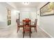 Cozy dining area with dark wood table and four upholstered chairs on tile flooring at 355 E Thomas Rd # B110, Phoenix, AZ 85012