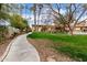 Scenic view of the meticulously landscaped grounds with lush green lawn and sidewalk along garden's edge at 355 E Thomas Rd # B110, Phoenix, AZ 85012