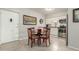 Bright eat-in kitchen with modern appliances, granite countertops, and dining table with four chairs at 355 E Thomas Rd # B110, Phoenix, AZ 85012
