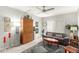 Well-lit living room featuring neutral tones, plush seating, and stylish decor at 355 E Thomas Rd # B110, Phoenix, AZ 85012