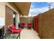 Inviting patio area with red furniture, perfect for enjoying the outdoors on a well maintained surface at 355 E Thomas Rd # B110, Phoenix, AZ 85012