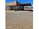 Charming home with a covered carport and inviting curb appeal, perfect for desert living at 35524 N 215Th Dr, Wittmann, AZ 85361