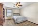 Neutral bedroom with a ceiling fan, carpet, and a comfortable bed at 4010 E Grandview St, Mesa, AZ 85205