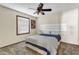 Clean bedroom with a ceiling fan, carpet, and a comfortable bed at 4010 E Grandview St, Mesa, AZ 85205