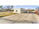 Detached two-car garage with a spacious driveway and basketball hoop, complemented by a well-kept lawn at 4010 E Grandview St, Mesa, AZ 85205