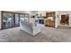 Spacious living room featuring a fireplace, sliding glass doors to the pool and a comfortable sofa at 4010 E Grandview St, Mesa, AZ 85205