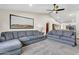 Relaxing living room with a comfortable sofa, vaulted ceilings, and plenty of space for entertaining at 4010 E Grandview St, Mesa, AZ 85205