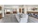 Open-concept living room with a comfortable sofa, fireplace, and large windows for natural light at 4010 E Grandview St, Mesa, AZ 85205