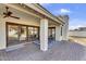 Covered patio featuring an outdoor dining area and views of the backyard at 4010 E Grandview St, Mesa, AZ 85205