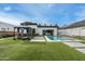 Scenic backyard featuring an inviting pool, gazebo, spiral staircase, and meticulously manicured turf at 4219 N 41St Pl, Phoenix, AZ 85018