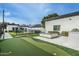 An entertainment backyard with synthetic grass and a putting green, plus a fire pit at 4219 N 41St Pl, Phoenix, AZ 85018