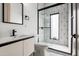 Modern bathroom with sleek vanity, updated fixtures, and a stylish shower with unique geometric tile at 4219 N 41St Pl, Phoenix, AZ 85018