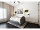 Cozy bedroom featuring a comfortable daybed, neutral decor, a ceiling fan, and dark wood floors at 4219 N 41St Pl, Phoenix, AZ 85018