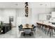 Open-concept dining room with a unique table, modern chairs, and views of the kitchen at 4219 N 41St Pl, Phoenix, AZ 85018