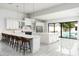 Bright kitchen featuring white cabinets, a large island, and stainless steel appliances, with pool views at 4219 N 41St Pl, Phoenix, AZ 85018