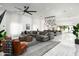 Spacious living room with tile flooring, a large sectional, and views of the pool at 4219 N 41St Pl, Phoenix, AZ 85018