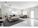 Spacious primary bedroom with ample seating, and light tile floors beneath elegant white curtains at 4219 N 41St Pl, Phoenix, AZ 85018
