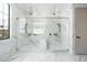 Spacious walk-in shower with dual shower heads and marble tile at 4219 N 41St Pl, Phoenix, AZ 85018