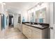 Bathroom features a double sink vanity, large mirror, and well maintained tile flooring at 4303 E Cactus Rd # 408, Phoenix, AZ 85032