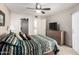 Neutral toned bedroom with ceiling fan, soft carpet, dresser and closet space at 4303 E Cactus Rd # 408, Phoenix, AZ 85032