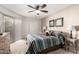 Comfortable bedroom with ceiling fan, neutral walls, and a large closet for ample storage at 4303 E Cactus Rd # 408, Phoenix, AZ 85032