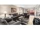 Comfortable living room with stylish sofas, a glass coffee table, and access to an outdoor space at 4303 E Cactus Rd # 408, Phoenix, AZ 85032